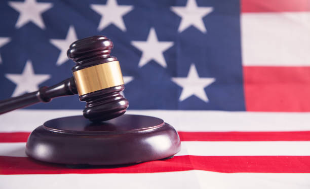 istock Judge gavel with American flag. 1153361949