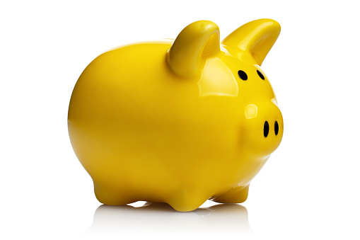 Yellow piggy bank, isolated on white background
