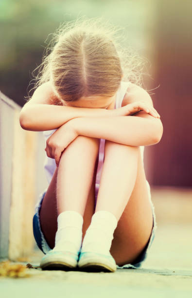 istock alone worried girl 1153366623