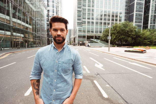 istock serious smart casual man in canary wharf 1153368002