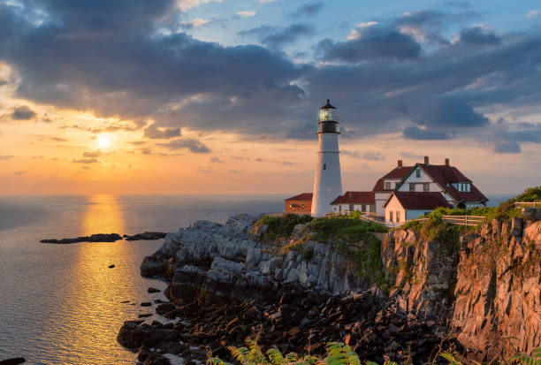 Portland Lighthouse at sunrise Portland Head Light at sunrise in Maine, New England. casco bay stock pictures, royalty-free photos & images