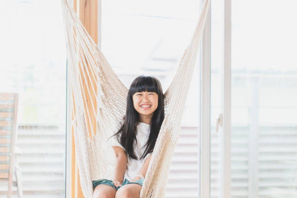 istock Girl relaxed in hammock at home 1153368742