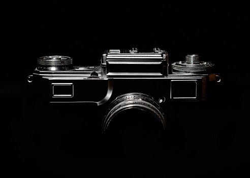 contour of a vintage camera in the dark
