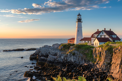 Sunrise at Portland Head Lighthouse in Cape Elizabeth, New England, Maine, USA.  One Of The Most Iconic And Beautiful Lighthouses.