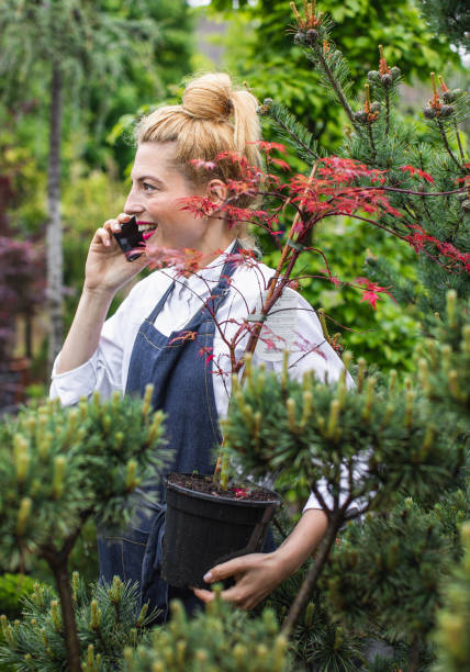 istock Garden Center Employee Talking on Phone 1153369859
