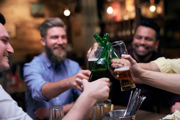 istock Group of men making a cheers for good weekend 1153370088