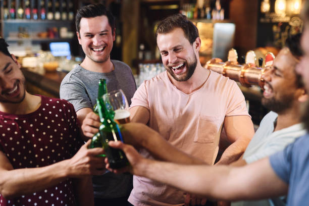 istock Group of friends chilling with drinks in the pub 1153370226