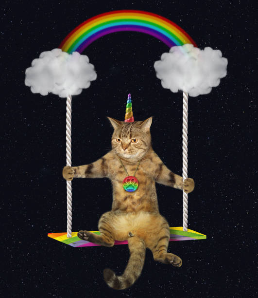 istock Cat unicorn riding on a cloud swing 2 1153371131