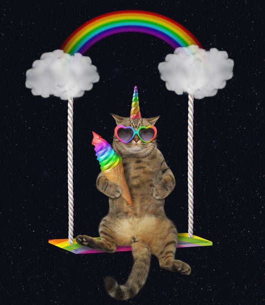 istock Cat unicorn with ice cream swinging 1153371140