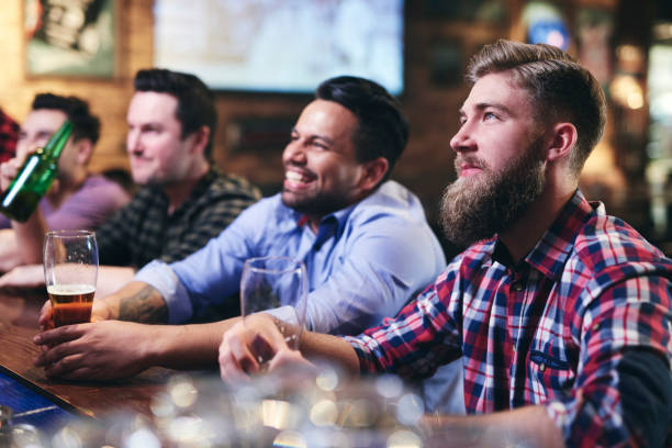 istock Focused man while watching american football 1153371176