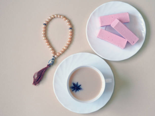 istock Sweets, candy on a plate on a pink background. 1153371494