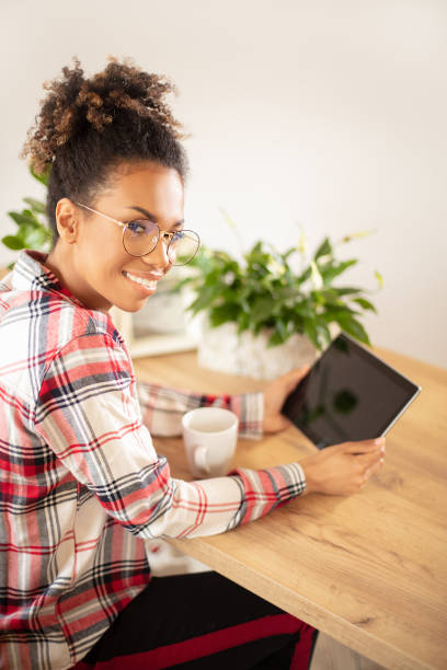 istock Afro woman working at the office. 1153371808
