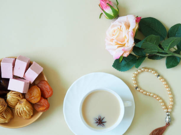 istock Sweets, marshmallow on a plate, tea on a beige background. Flower. 1153371857