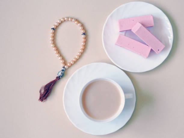 istock Sweets, candy on a plate on a pink background. 1153372438