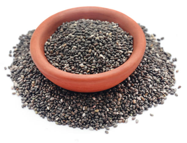 Organic Chia Seed Organic Chia Seed, super food in a bowl over white background salvia hispanica plant stock pictures, royalty-free photos & images