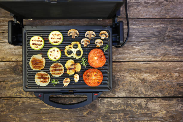 istock Grilled vegetables on old wooden background. Top view. Flat lay. 1153376182