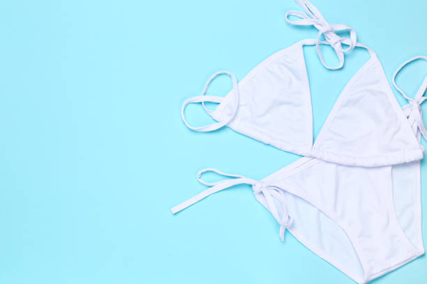 istock Fashion swimsuit on blue background 1153377005