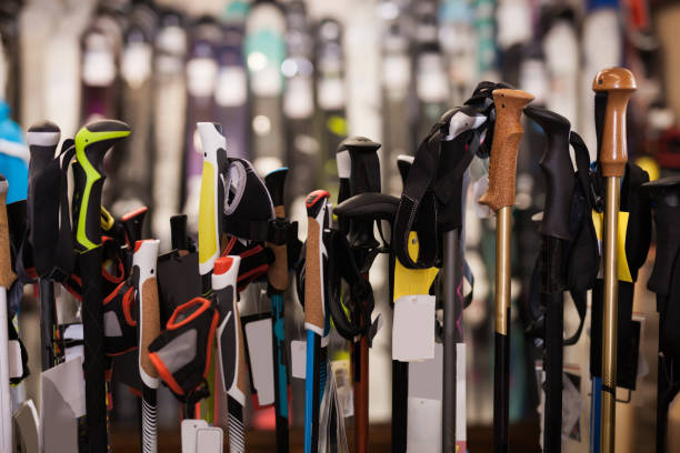 istock Assortment of ski poles in foreground 1153378888