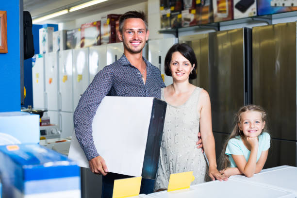 istock family in home appliances hypermarket 1153378910