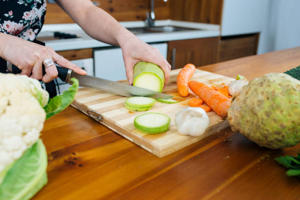 istock Woman in the Kitchen Chopping Some Veggies 1153379232