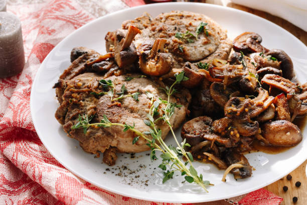 istock Homemade fried chicken with mushrooms with spices 1153384231