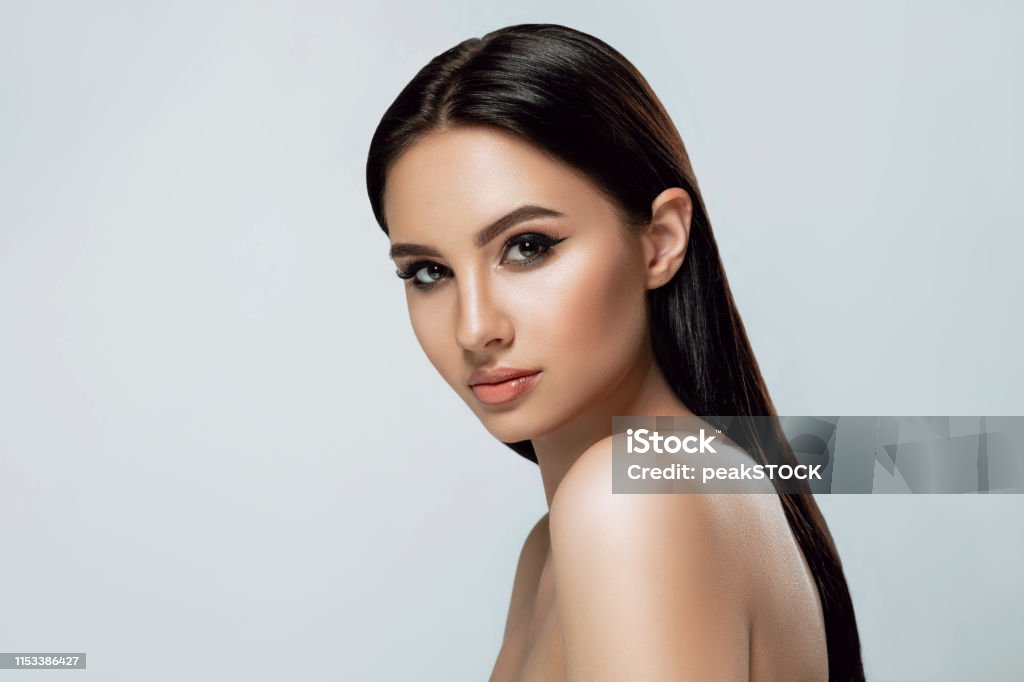 Beauty portrait. Brunette woman with tanned skin and brown eyes and fresh healthy skin. Fashion Model Stock Photo