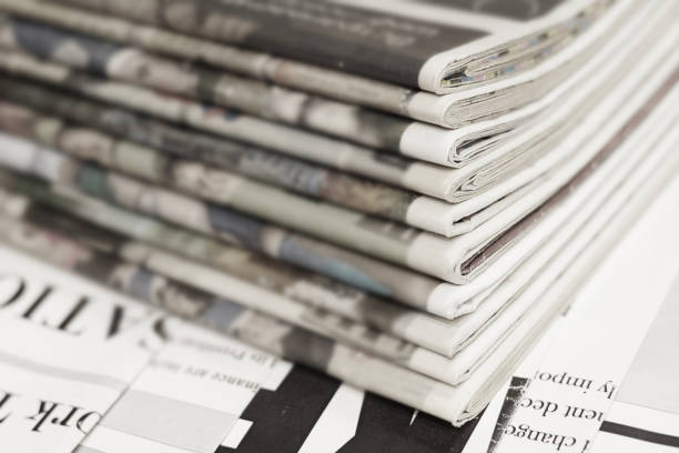 istock Stack of Newspapers and News Pages 1153388319