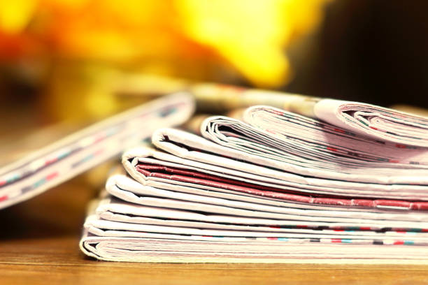 istock Stack of Newspapers with News 1153388576