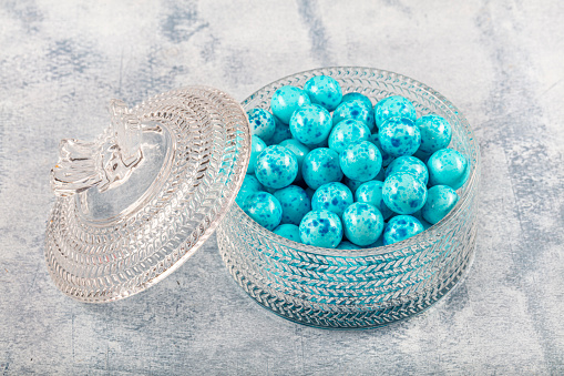 Blue, chocolate, Candy, balls in bowl. I serve candy at holiday. Feast concept.