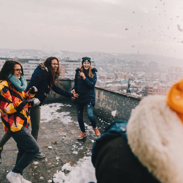istock Snowball fight with my friends 1153390295