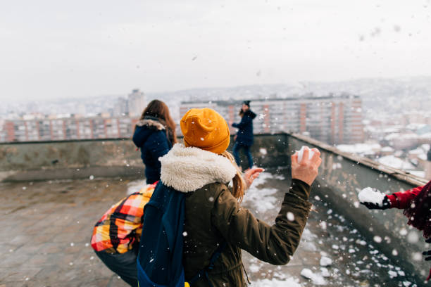 istock Snowball fight with my friends 1153390402