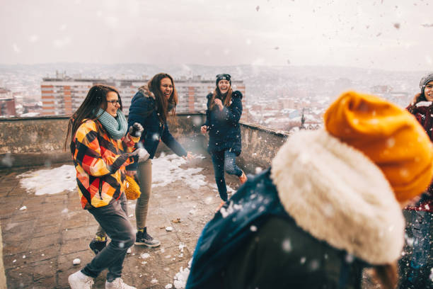 istock Snowball fight with my friends 1153390403
