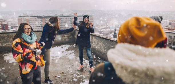 istock Snowball fight with my friends 1153390439