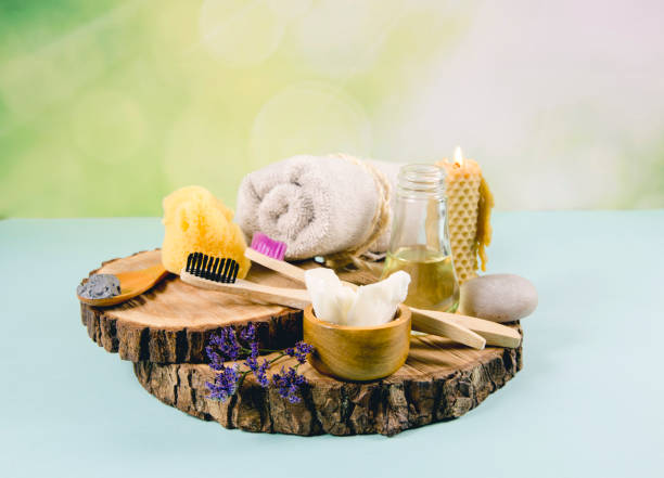 istock Using natural material products in home, different cosmetic products in bathroom. Minimizing ecological footprint concept. Bamboo bath towel, biodegradable bamboo toothbrush, clay mask, coconut oil. 1153391177