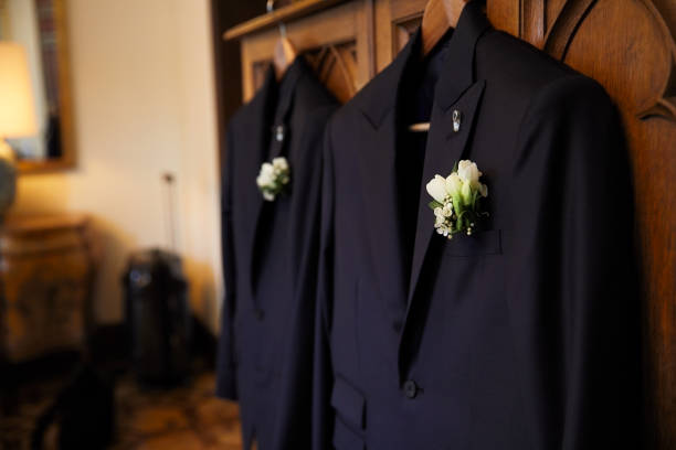 Pair of suits hanging ready for the wedding. Wedding concepts, getting ready for the big day. Homosexual couple marring in Barcelona. civil partnership stock pictures, royalty-free photos & images