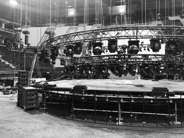 Installation of professional concert equipment. Truss with spot lighting equipment above the stage.