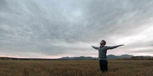 istock Young man standing in autumn meadow 1153398112