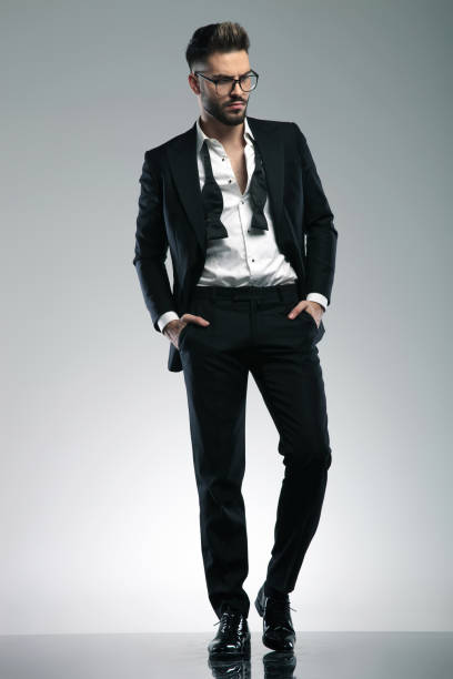 istock Charming guy stepping and curiously looking to the side 1153398263