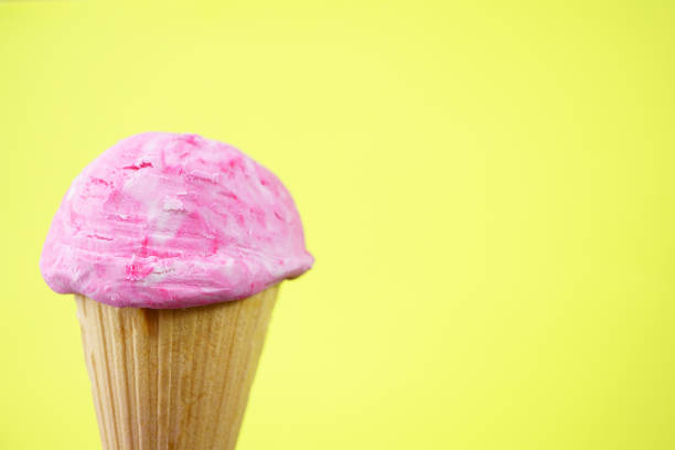 istock Strawberry ice-cream scoop in waffle cone 1153398523