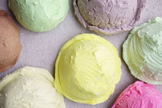 istock Ice cream scoops of different colors and flavors 1153398561