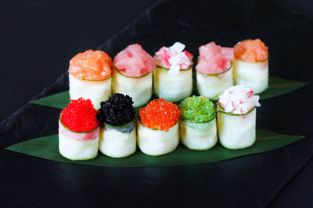 istock Seafood delicatessen, sushi rolls set on slate 1153398639