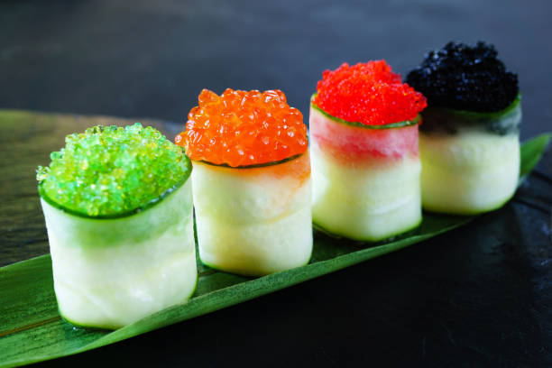 istock Red and tobiko caviar topped sushi rolls set 1153398646