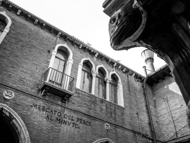 a detail of the ancient market fish of rialto along the grand canal in the historic heart of venice - market rialto bridge venice italy italy imagens e fotografias de stock