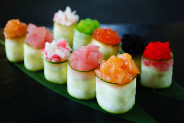 istock Seafood delicatessen, sushi rolls set on slate 1153398745