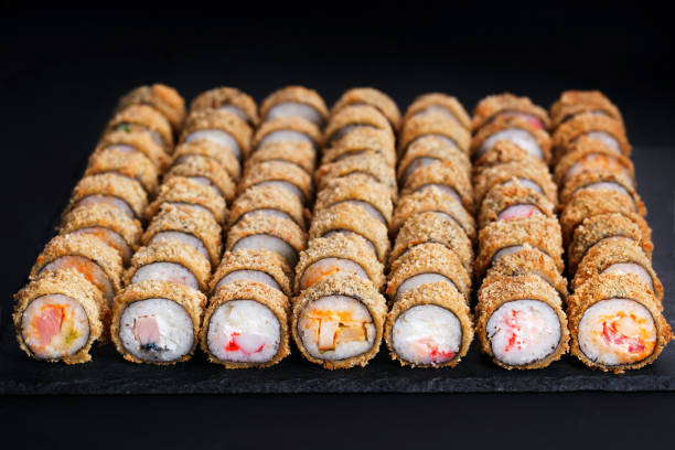 tempura maki sushi rolls set on black slate - buffet japanese cuisine lifestyles ready to eat imagens e fotografias de stock