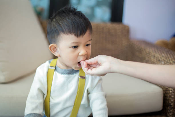 istock Asian baby boy eating blend food 1153400021