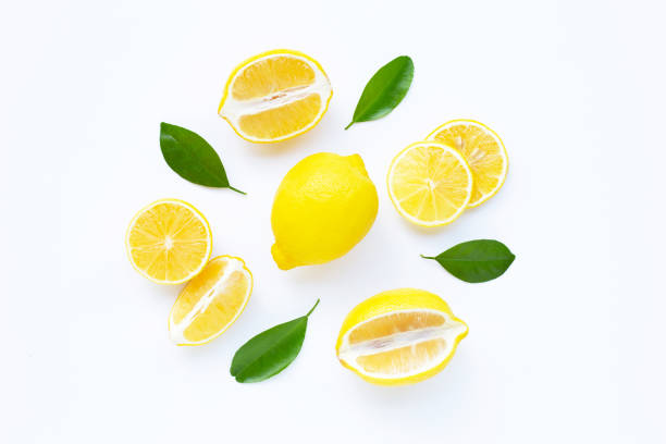 istock lemon and slices with leaves isolated on white. 1153400182
