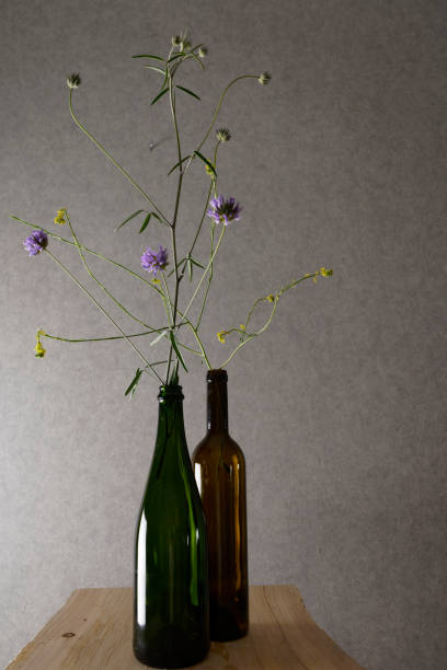 istock wildflowers in bottles 1153400325
