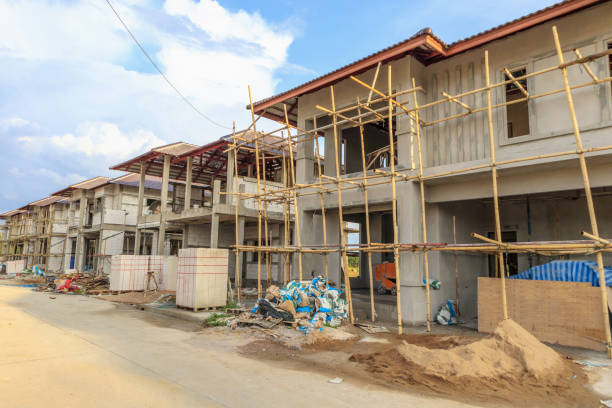 istock construction residential new house in progress at building site with clouds and blue sky 1153403010