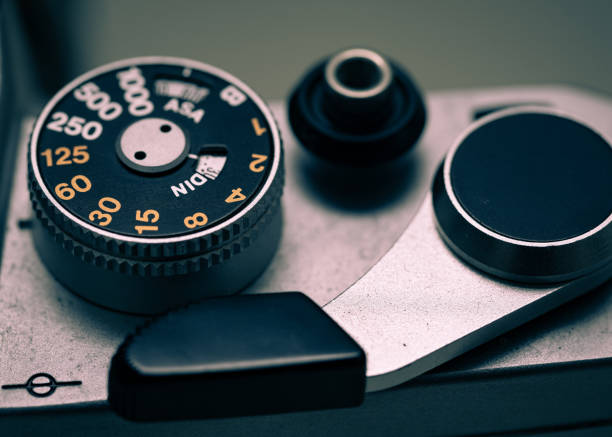 istock Old antique SLR camera shutter dial macro photo 1153403824